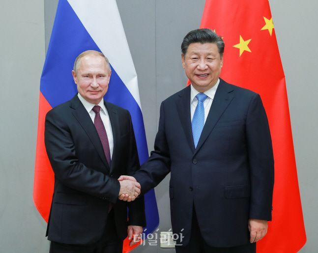 Presidente chinês Xi Jinping e presidente russo Vladimir Putin (foto de arquivo) ⓒShinhwa / Newsis