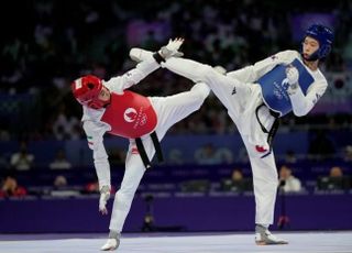 세계랭킹 24위 김유진, 반전의 금메달…태권도 상위랭커 줄줄이 연파